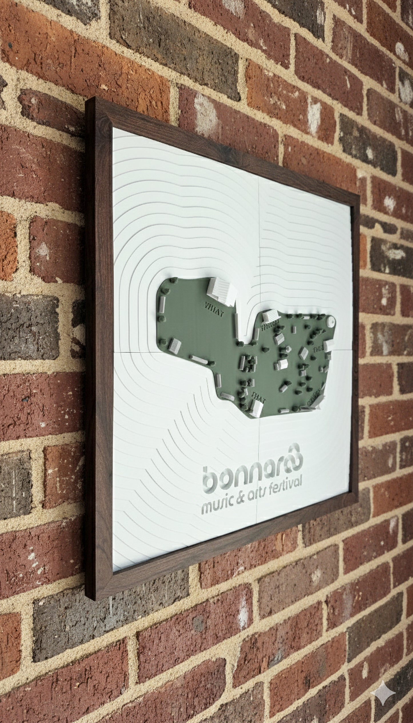 A 3d-printed model of the bonnaroo festival map hanging on a brick wall