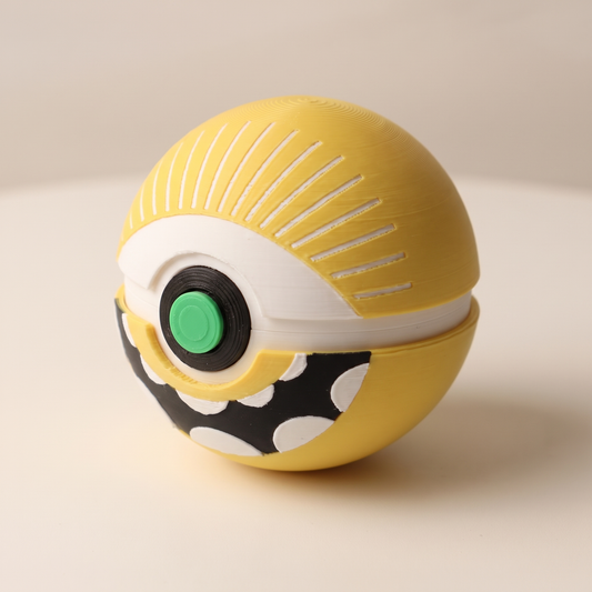 Cyclops Memory Capsule with yellow eye top, green button, and toothy grin on its white stand