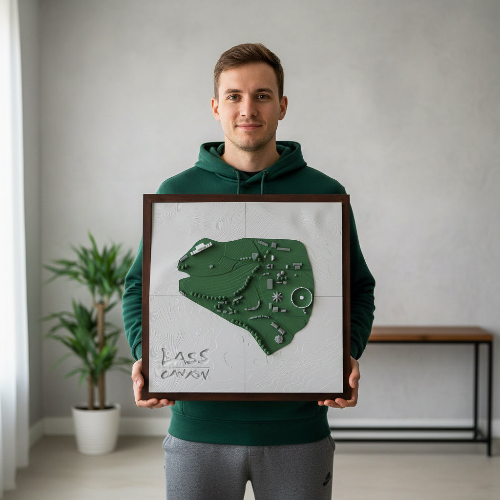 Man holding a framed map of Lago Caney in a room with a plant and bench.