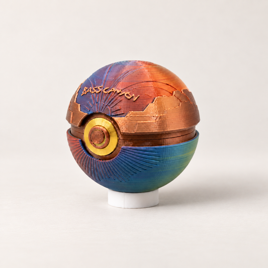 Bass Canyon Memory Capsule with copper canyon walls and sunset gradient shell on its display stand