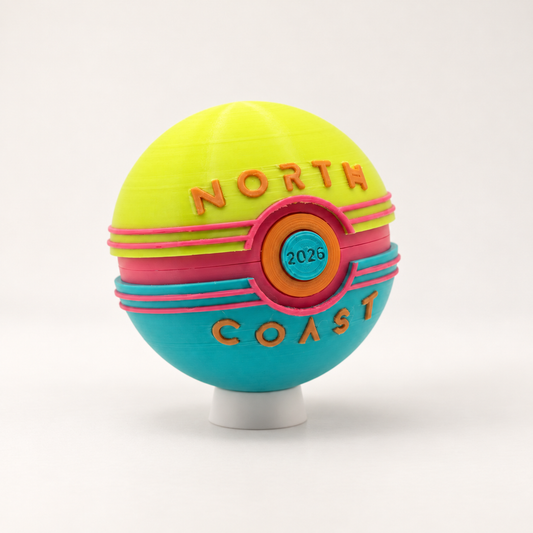 North Coast Memory Capsule on a white stand against a warm neutral background