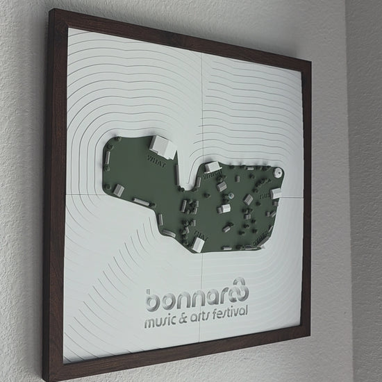 A 3d-printed model of the bonnaroo festival map hanging on a wall