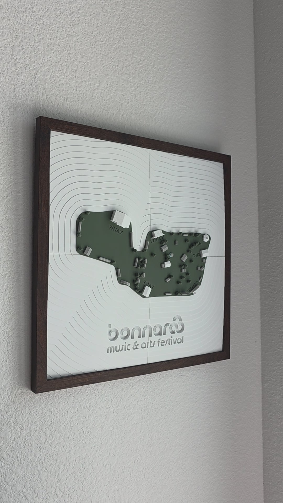 A 3d-printed model of the bonnaroo festival map hanging on a wall
